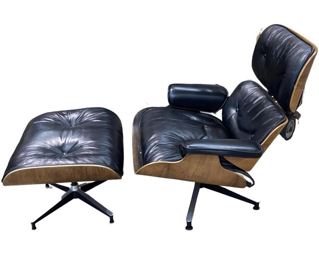 Genuine Vintage Eames Leather Chair & Ottoman Set: Vintage genuine designer Herman Miller, Inc. Charles & Ray Eames chair and ottoman set crafted of wood and navy blue leather. Chair measures approx. 32 3/4" height x 33 1/4" width x 34" depth. Ottoman