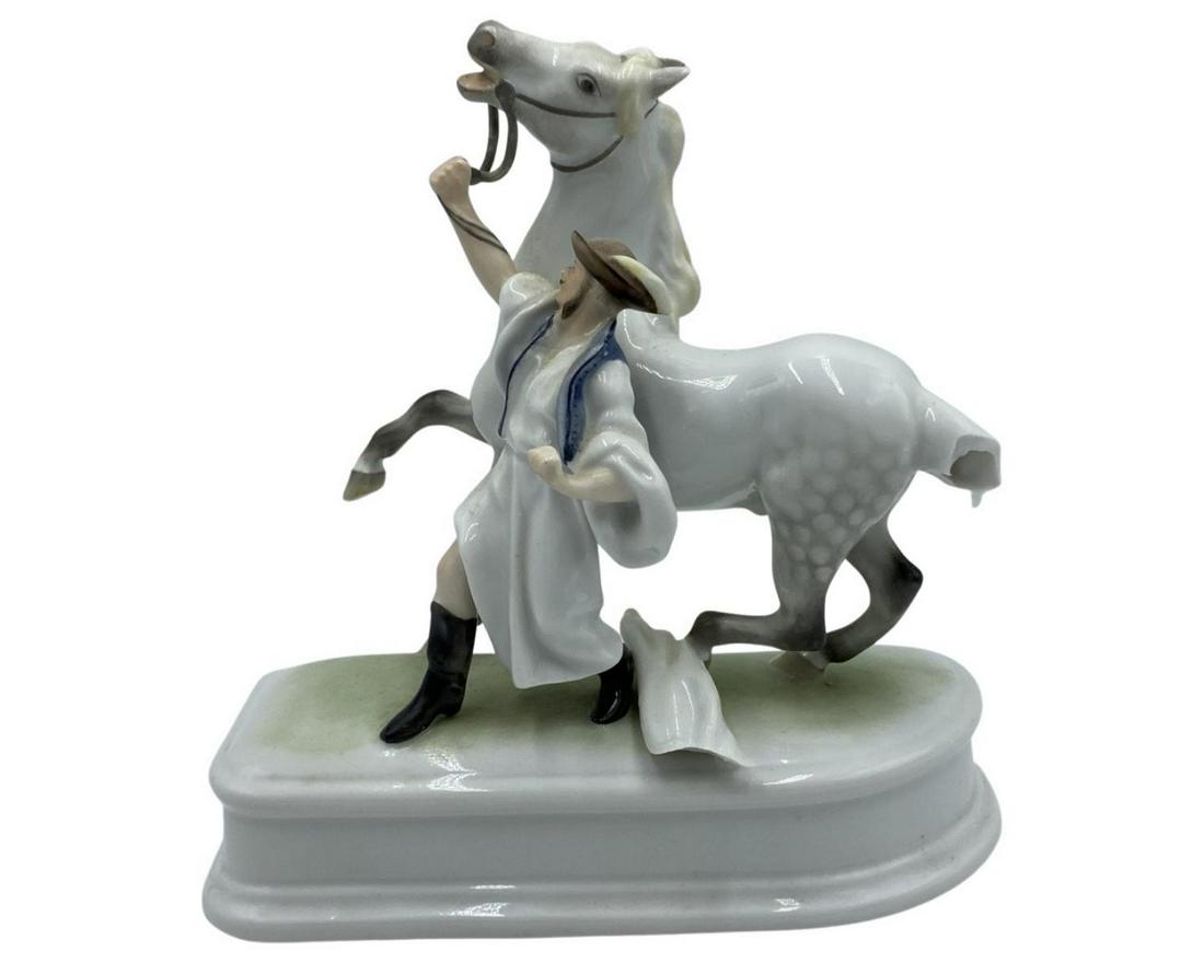Herend Hungarian Hand Painted Porcelain Horse and Trainer: Herend Hungarian Hand Painted Porcelain Horse and Trainer measures H: 8" x L: 8". The tail is broken, sold as is