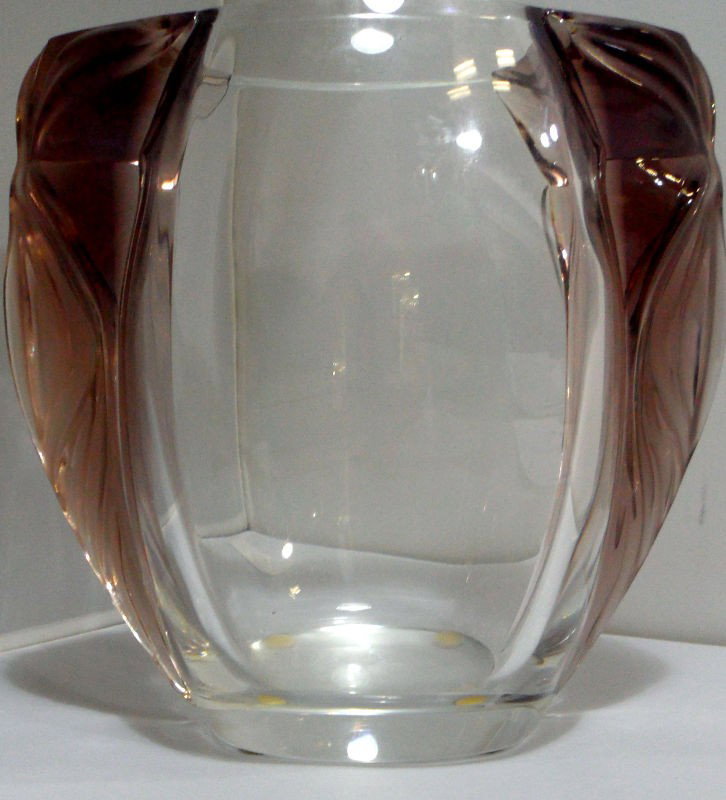 Lalique Vase with Violet Accents: Beautiful clear Lalique vase with violet accents on the sides. This is truly a great addition to any Lalique collection. Frosted colored glass is generally more valuable than or clear. Signed Lalique 