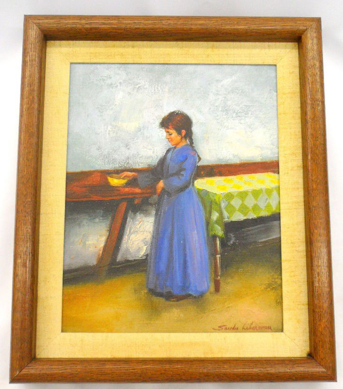 Sandu Liberman Oil Painting On Canvas.: Oil painting on canvas depicting a young girl standing with a bowl on her hand next to a table. The table has a green and white checkered tablecloth. She is dressed in a long blue dress and has her ha