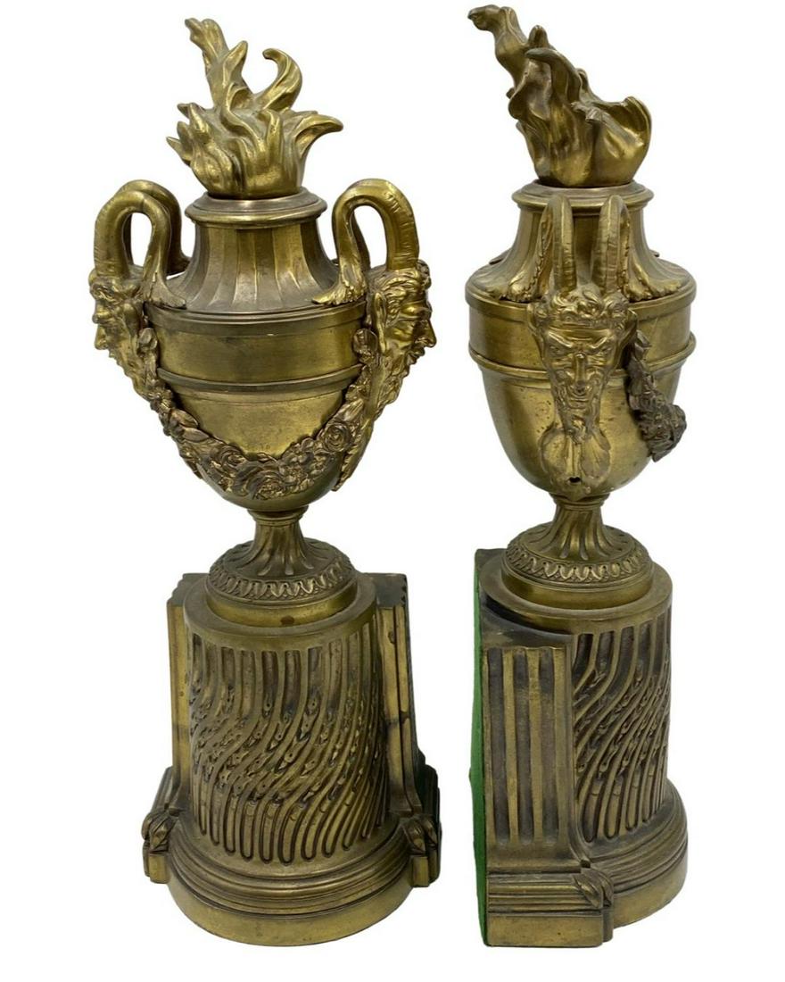 Pair of French Bronze Bookend Urns with Figural Handles: Pair of French Bronze Bookend Urns with Figural Handles measures H: 16"