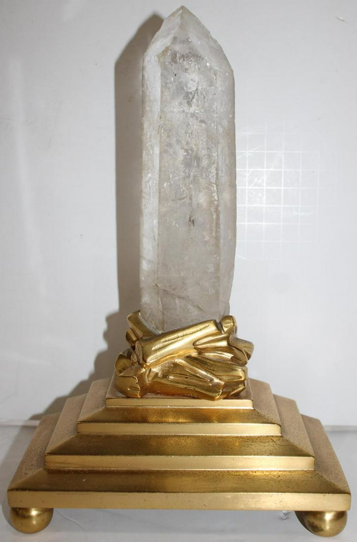 French Ormolu Dore Gilt Bronze & Rock Crystal Sculpture: A French ormolu dore gilt bronze base set with a genuine rock crystal clear quartz obelisk phallic from stone. Measures approx. 11 1/2" height.
