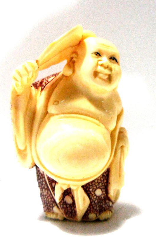 Chinese Carved Ivory Netsuke: Chinese carved ivory netsuke depicting a fat man with a fan. Signed on bottom. Measures 1 3/4" high. Shipping within the continental US is $15 plus required insurance. No international shipping.