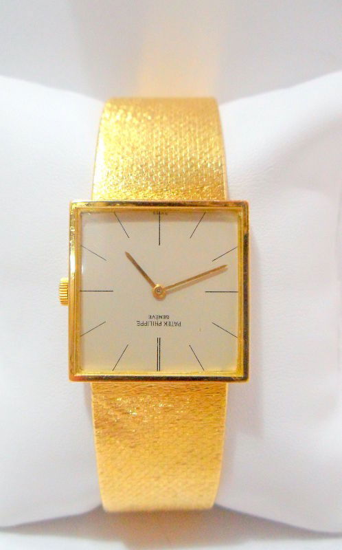 Patek Philippe Ca. 1960s 18K Y.G. Watch: 18k yellow gold circa 1960s Patek Phillipe bracelet watch. This tripple signed watch features a 18 jeweled manual wind, 26mm square case, silver dial, black markers with gold hands. Watch is in workin