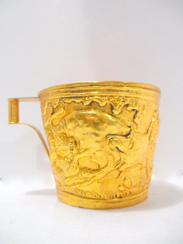 Lalaounis Gilt Silver Cup: Lalaounis gilt silver cup. Greek gilt silver cup stamped: "900, Lalaounis" Bulls in relief in Etruscian manner, Measures 3 1/2" high x 5" wide. Shipping within the continental US is $15 plus Required 
