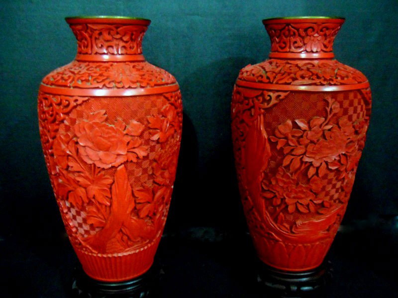 Pair of Chinese Cinnabar Lacquer Vases: Pair of intricately carved Chinese cinnabar lacquer vases. Each piece contains two panels with beautiful carved images of chrysanthemums. The bottoms and interiors are glazed blue. 9.5" H. Shipping wi