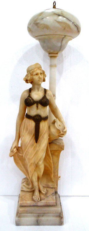 Rare Alabaster & Marble Figural Lamp: Rare Alabaster figural lady lamp. Depicts a young woman holding a jug on stamps dressed in Roman attire. Measures 38 1/2" high x 10 1/2" wide. Please call for shipping plus required insurance quotes 5