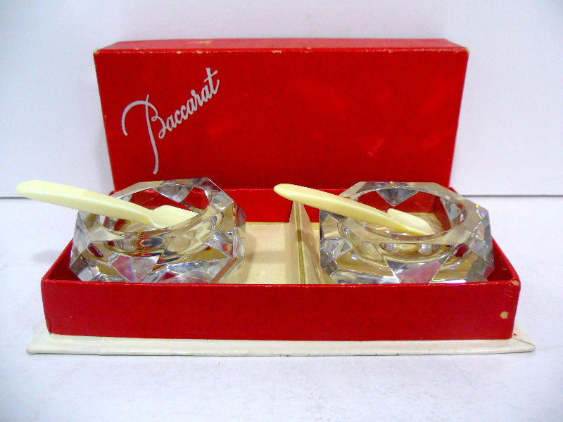 Baccarat Salt Cellars with Ivory Spoons: Baccarat Salt Cellars with Ivory Spoons. Measures 2 1/4" wide. Shipping within the continental US is $20 plus required insurance. No international shipping.