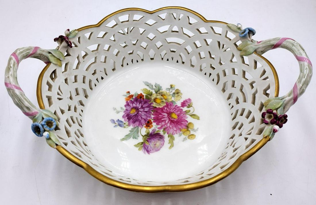 WWI Berlin KPM German Porcelain Handled Open Basket Bowl: World War I era Art Nouveau style Berlin KPM German porcelain handled openwork scrolled handled basket bowl. Interior decorated with floral bouquet. Exterior with gilt accent. Bottom with orb and scep