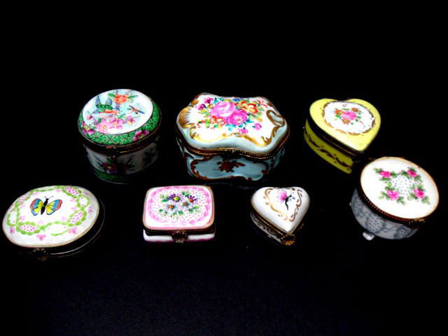 Limoges Painted Porcelain Boxes (7): Set of 7 Limoges hand painted porcelain boxes. Each one displays a Limoges symbol in underglaze on the bottom. Metal mounts are included for the hinges and clasps. Sizes range from 1 1/4" X 1 3/4" to 