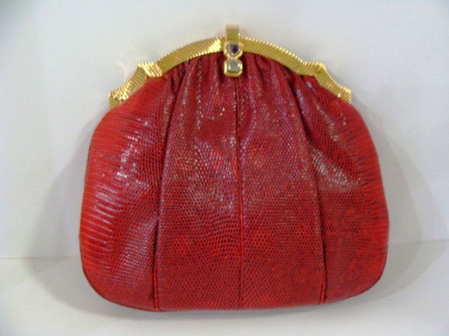 Vintage Judith Leiber Red Lizard Purse: Vintage Judith Leiber purse. This is a beautiful purse by Judith Leiber made with red mottled lizard with gold and hardstone clasp. Red fabric interior, original comb and change purse included. Also,