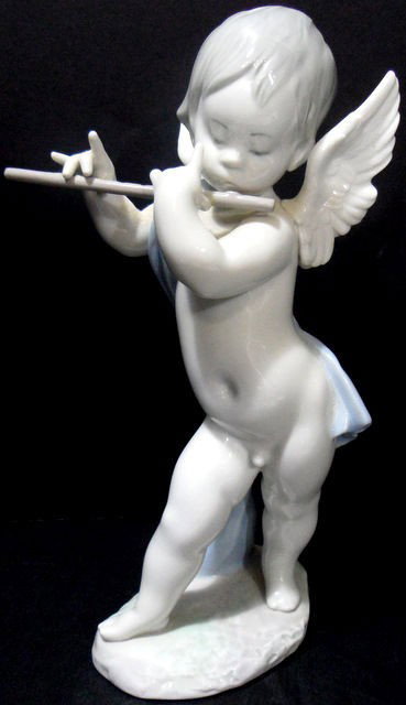 Lladro Porcelain Figure "Angel with Flute": Lladro porcelain figure "Angel with Flute." No. 1233G, Issued 1972, Retired 1987. 8 1/2"H. Current retail: $480.00. Shipping within the continental US is $40 plus Required insurance. For international