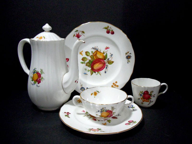 Royal Worcester Delecta Porcelain Dish Set: Set of Royal Worcester Delecta pattern porcelain. The set includes 10 luncheon plates, 11 dinner plates, 8 salad plates, 12 tea cups, 2 cream soup bowls, and a coffee pot. Dinner Plate: 10 1/2"D, Lunc