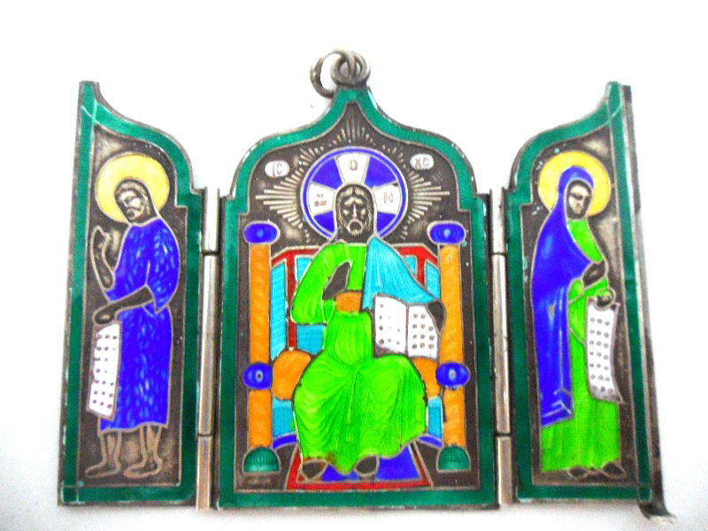Russian Sterling and Enamel Triptych: Russian sterling and enamel triptych. A small travel triptych with icons. Assayer is marked as Alexander Franz. Fan-der-Flit. Hallmarks are visible when the piece is closed. 2 1/2"H X 3"L. 1t oz. Ship