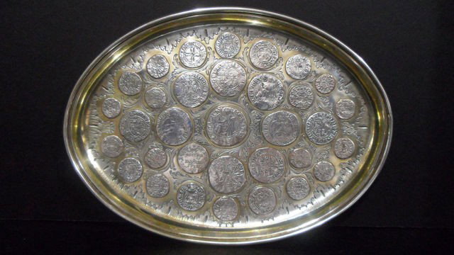 Antique Oval 800 Sterling Coin Tray: Antique Oval 800 Sterling Coin Tray. This is a marvelous hand wrought footed dish with a coin motif. Initials RW on bottom. Marked 800 silver. Measures 8 3/4" long x 6 1/2" wide, weighs 9.6 toz. Shipp
