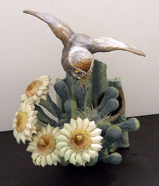 Royal Worcester "Moonlight" Figurine: Royal Worcester Figure entitled "Moonlight" depicting an owl flying above a cactus plant. Height 11". SHIPPING & REQUIRED INSURANCE $100.00 WITHIN THE CONTINENTAL U.S., FOR INTERNATIONAL SHIPPING QUOT