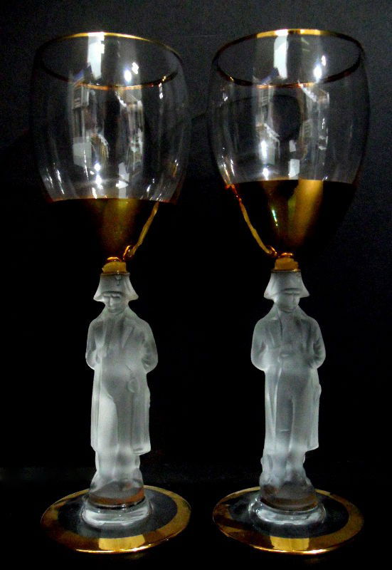 Gold Rimmed White Wine Glasses with Napoleon (17): Set of 17 white wine glasses with a gold rim and a stem molded in the shape of Napoleon Bonaparte. Each glass features Napoleon in his signature pose, with one hand tucked into his jacket, as the stem