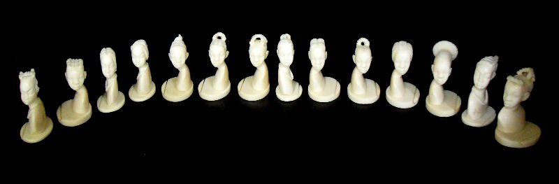 African Ivory Heads (14): Set of 14 small African ivory heads. Each piece is skillfully carved. Measures 2 1/2" high. Please call for shipping plus required insurance quotes 561-585-9999 or email us at liveauctions@brucekodner