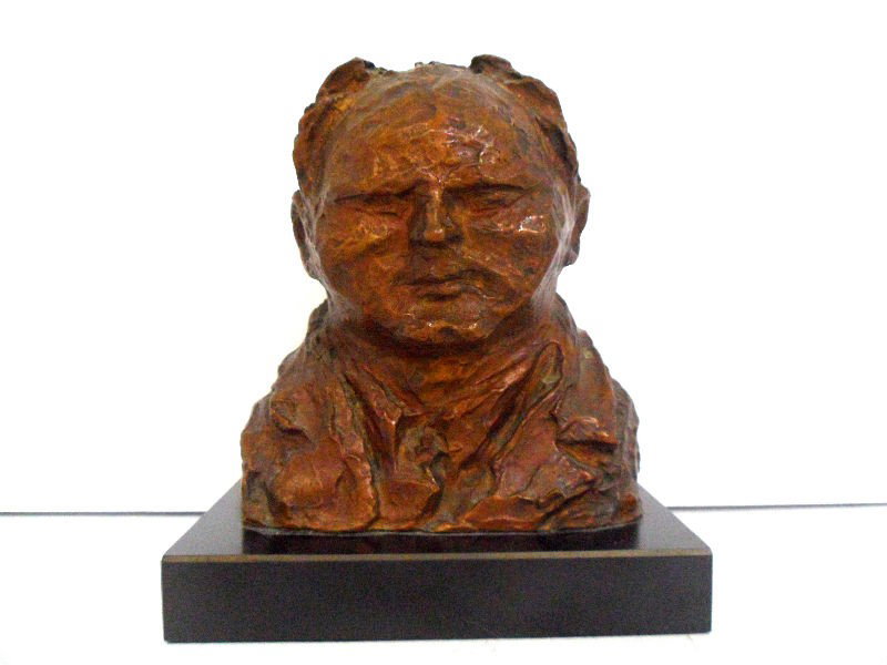 Isaballa Howland Bronze Bust of Reginald Marsh: Bronze bust of American artist Reginald Marsh by Isabelle Howland. Howland, and American sculptress, created bronze figures of artists in the early part of the 20th century. The piece is exceptionally