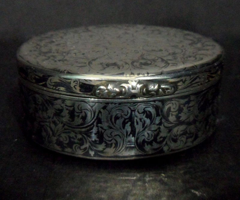 Russian Sterling Silver Round Box: Russian sterling silver round box. A beautiful scroll work pattern decorates the entire exterior, and there is a contrast in the deisgn between light and dark. The inside features an unidentified make
