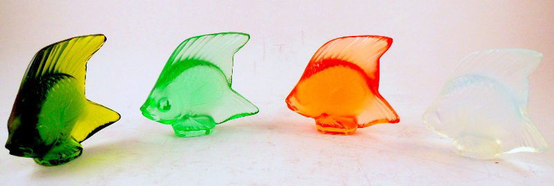 Lalique France Collection of Fish (4): Lalique France Collection of Four Fish. Lalique stamped on bottom of pieces. Measures 1 3/4" high. Shipping within the continental US is $25 plus Required insurance. For international shipping and req