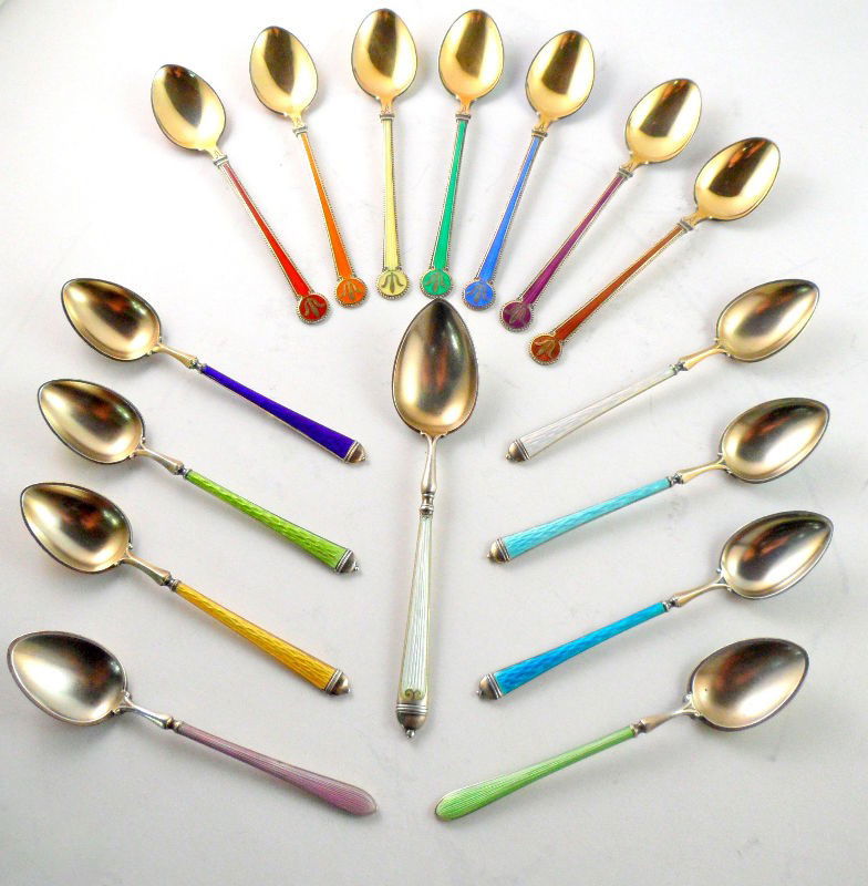 David Andersen Norwegian Sterling Spoons (16): Group of sterling silver and enamel spoons by Oslo, Norway silversmith David Andersen. Seven of the spoons feature a dot pattern on the back of the bowl and the other nine spoons are solid in their en