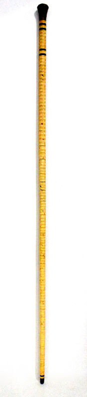 Antique Ivory Cane with Horn Ovoid Grip: Antique ivory Cain with horn ovoid grip. The piece is elegant and has bands of dots in concentric rings that begin at the collar and continue down the entire shaft. The grip and the ferrule is made of