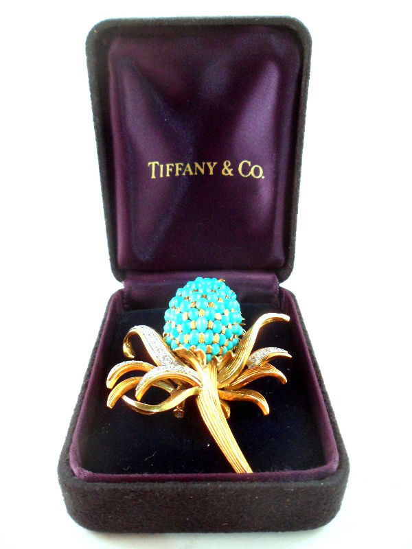 Tiffany 18K Yellow Gold Vintage Turquoise Brooch: Tiffany pineapple-shaped brooch set with approx. 1.25 ct. diamonds and turquoise stones. The pin is crafted of lustrous 18K gold and secures with a safety pin. Weight 25.2 dwt. Comes with Tiffany & Co