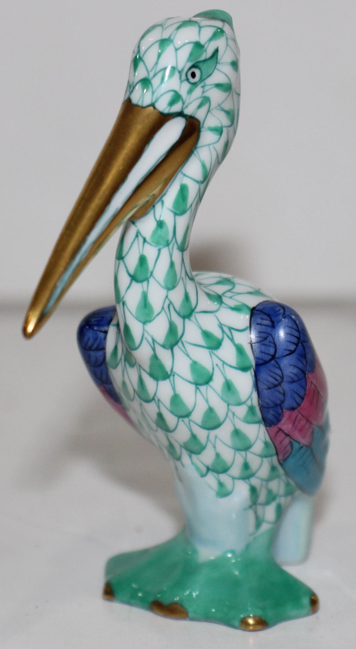 Herend Hungarian Fishnet Porcelain Pelican Bird Sculpture: A Herend Hungary hand painted porcelain figural pelican bird sculpture. Measures approx. 3 1/2" height.