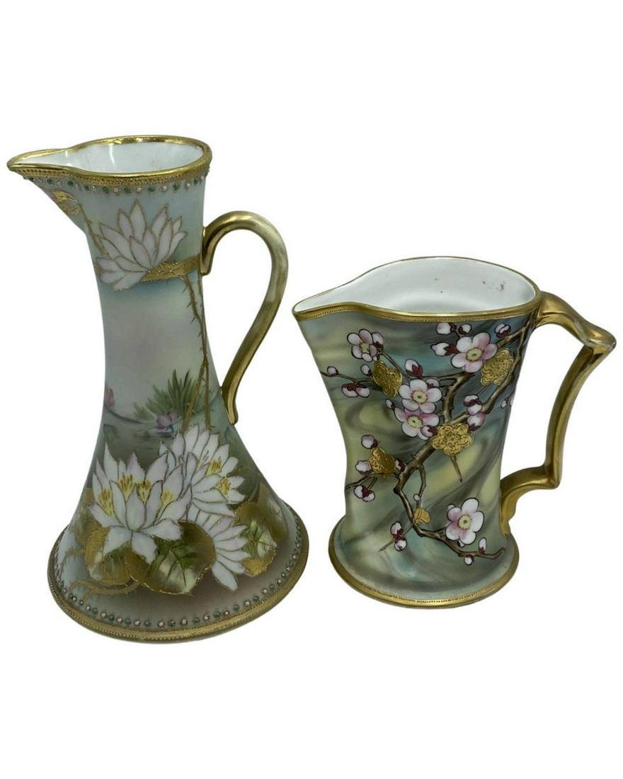 Pair of Nippon Hand Painted Porcelain Flower & Flower Blossoms Pitcher: Pair of Nippon Hand Painted Porcelain Flower & Flower Blossoms Pitcher. Largest measures H: 10 1/2"