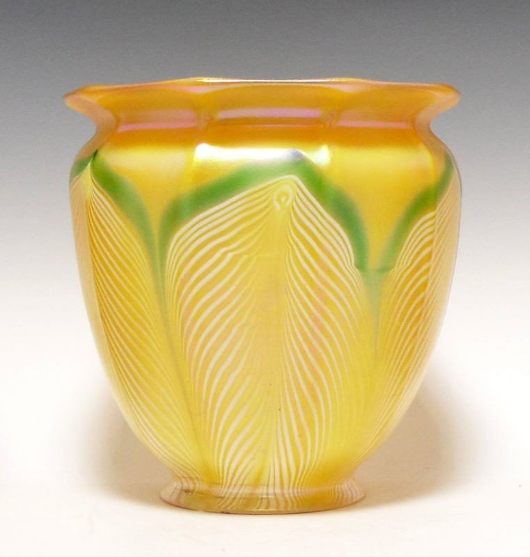 Quezal Iridescent Glass Shade: Quezal iridescent glass shade. Each piece features a gold iridescent body with a white pulled feather effect; the pulled feathers have light green borders/ The shades are in a floral form, and light s