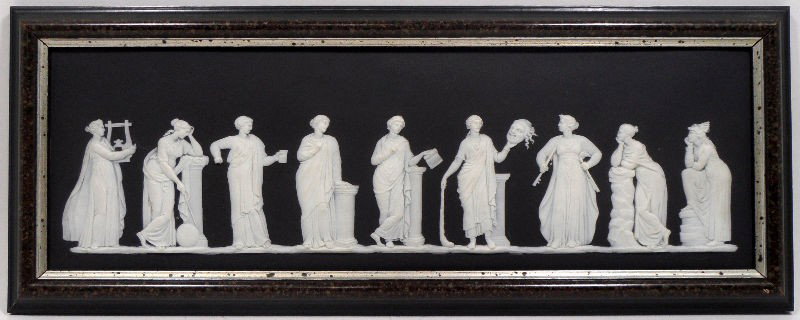 Wedgwood Jasperware Greek Frieze: Wedgwood jasperware Greek frieze. The black based jasperware depicts heroes of Greek myths standing in a frieze. Piece is framed. Marked Wedgwood on the back. Measures 17 3/4" X 5 1/2", frame measures