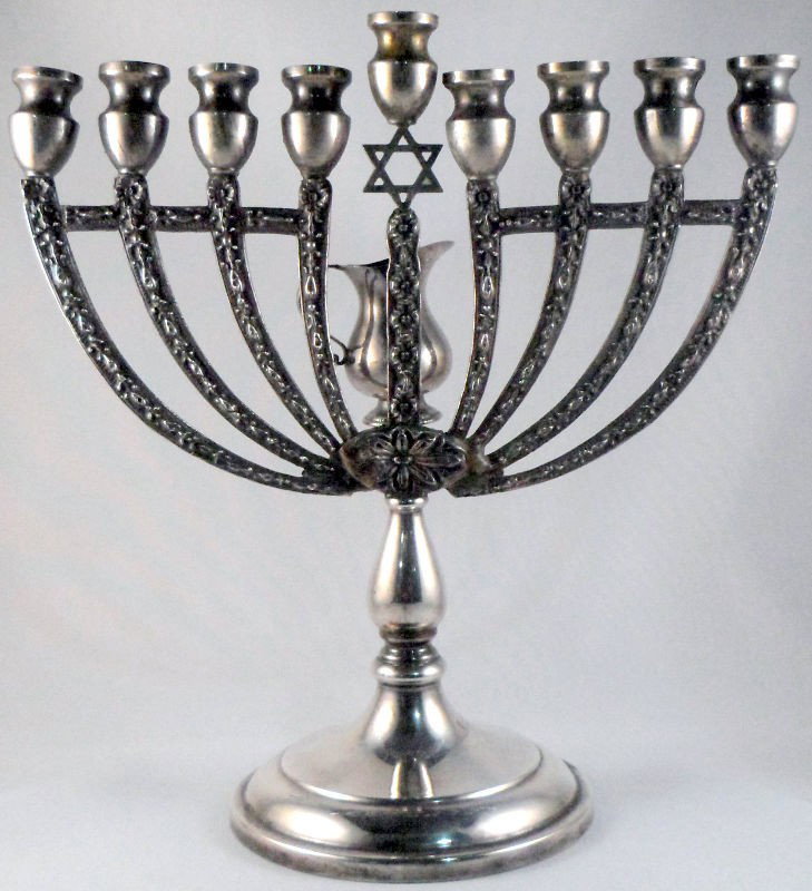 Sterling Silver Hanukah Menorah: Sterling silver Hanukah Menorah, marked sterling on bottom. Just in time for the holidays!, 11.13 toz, Measures 9 inches high x 9 inches wide, base has a 4 3/8 inch diameter.