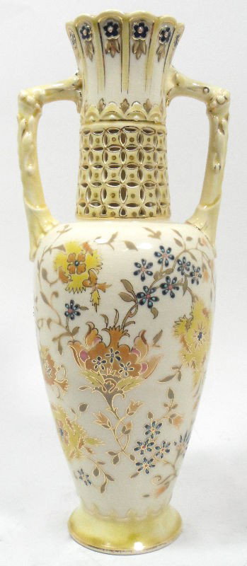Zsolnay Hungarian Porcelain 2-Handled Vase: Zsolnay Hungarian porcelain 2-handled vase with reticulated neck and fanciful multi-colored floral design on a creamy yellow background. Guaranteed to enhance any fine porcelain collection. Zsolnay ha