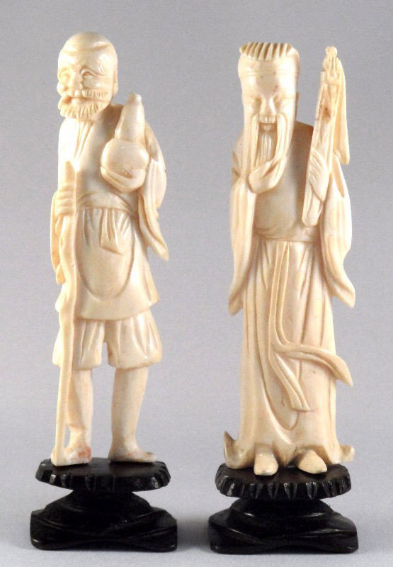 Chinese Carved Ivory Wise Men (2): Chinese carved ivory wise men. One holding a staff and gourd, and one holding his beard and a scepter. Both on wooden bases. Both measures 4"H (not on stand). Shipping within the continental US is $20