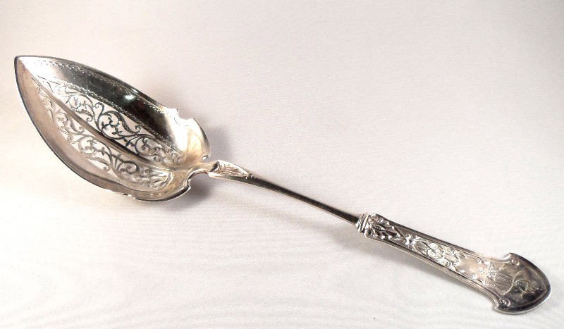 Star & Marcus Sterling Silver Serving Spoon: Beautiful elongated riticulated Starr & Marcus sterling silver serving spoon with an ornate monogram in the cartouche. Weight: 2t oz. Measures 9 1/2"L. For Domestic and international shipping quotes p