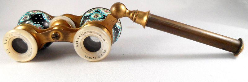 Champlevé and Mother of Pearl Opera Glasses: Champlevé and mother of pearl opera glasses. The mother of pearl eye pieces are marked La Reine, Paris and Bitterman Bros. Evansville, Ind. Measurements with handle extended: 4"L X 4 1/2"W. For Domes