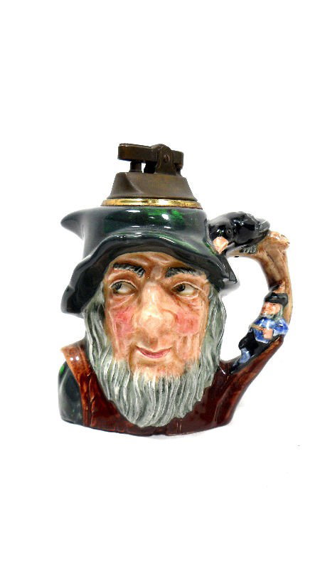 Royal Doulton "Rip Van Winkle" Toby Mug/Lighter: Royal Doulton porcelain "Rip Van Winkle" toby Mug, which has been turned into a table lighter. Marked Royal Doulton on the bottom. Measures 5 1/2"H. For Domestic and international shipping quotes plea