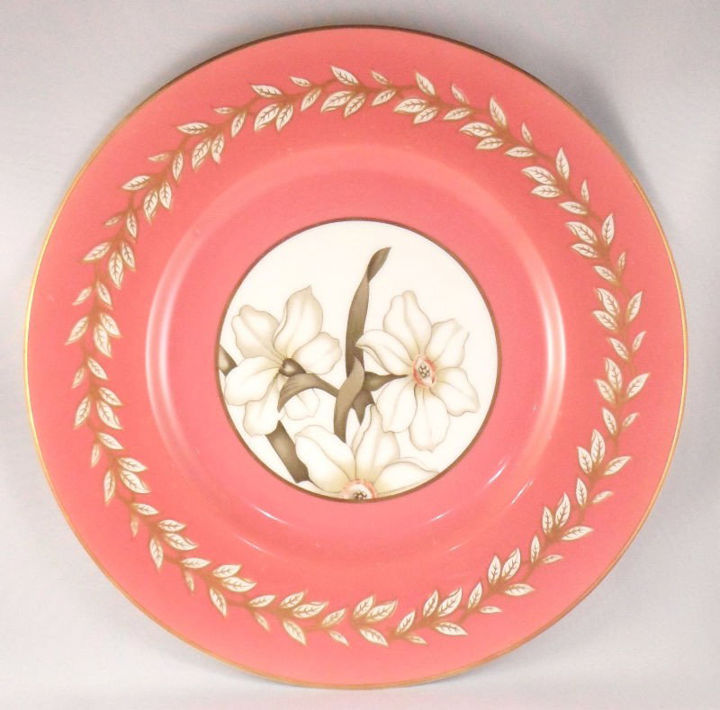 Royal Worcester "Narcissus" Plates (12): Royal Worcester set of 12 "Narcissus patter plates. The plates are a dark pink with a gilded rim and a floral design in the center. Marked Royal Worcester and "Narcissus" on the back. Measures 10 1/2"