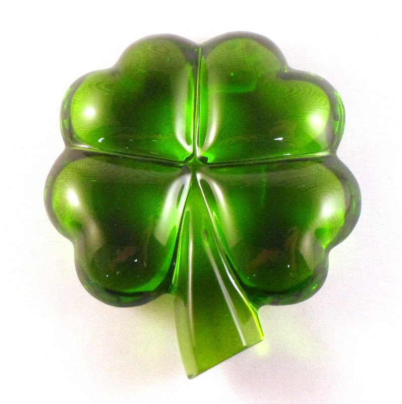 Baccarat Crystal Four Leaf Clover #1762682: Baccarat crystal four leaf clover #1762682 with four heart-shaped leaves. Just in time for Valentine's Day or St. Patricks Day. Baccarat stamp on stem. Measures 4 1/8" X 4 1/8". For Domestic and inter