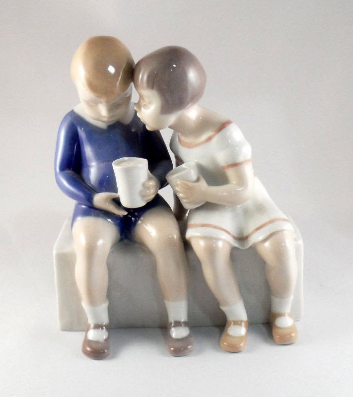 Royal Copenhagen Porcelain Figurine #2175: Royal Copenhagen porcelain figurine of two children holding cups and talking, numbered 2175. Measures 5 1/2" X 4 3/4". For Domestic and international shipping quotes please email Ryan@eagleshippingcen