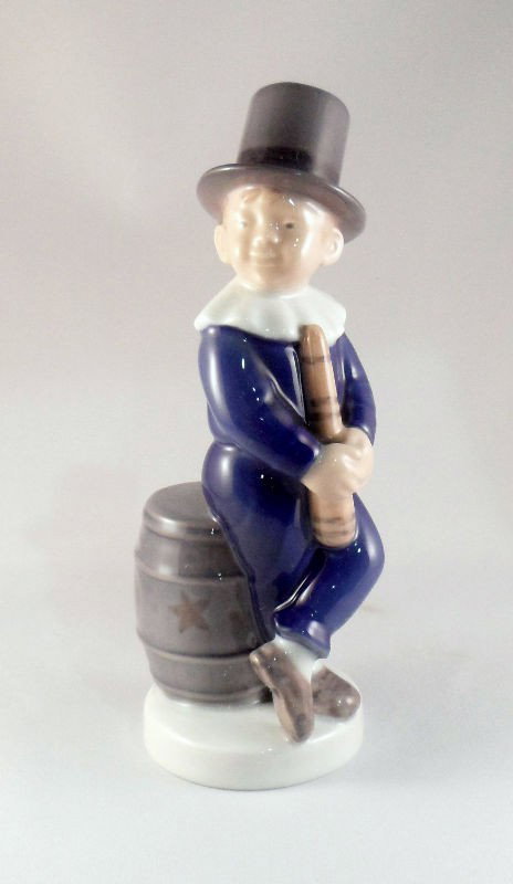 Royal Copenhagen Porcelain Figurine #4524: Royal Copenhagen porcelain figurine of a boy sitting on a barrel in a top hat, numbered 4524. Measures 6 3/4"H. For Domestic and international shipping quotes please email Ryan@eagleshippingcenter.com