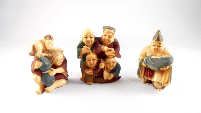 Chinese Ivory Polychrome Netsukes (3): Chinese ivory polychrome netsukes. The three separate figurines represent different actions in daily life. One depicts four fisherman, one shoes a woman with a horse and a gourd, and the third shoes a