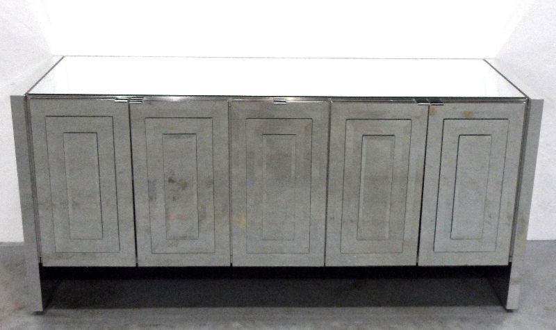 Art Deco Style Mirrored Sideboard: Art Deco style mirrored sideboard. This fabulous piece has 5 doors and drawers and shelves inside. The entire piece has a mirrored surface. Measures 29 1/2" X 21" X 63 1/2". For Domestic and internati