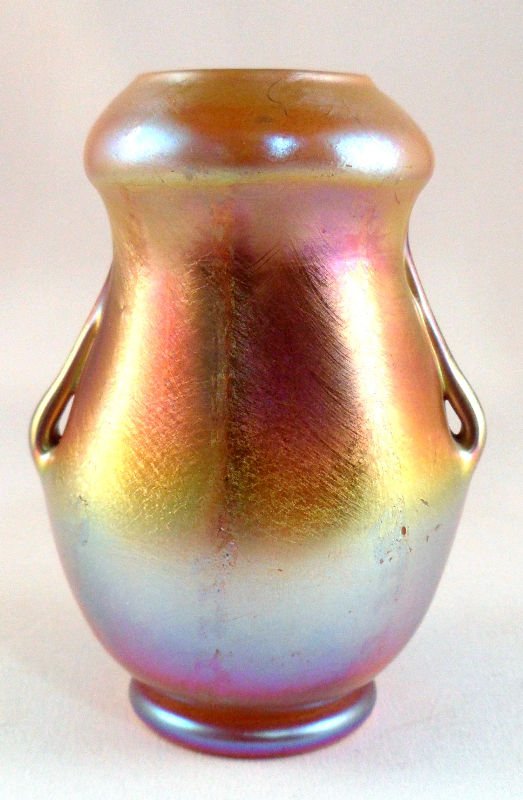 Tiffany Studios Favrile Iridescent Glass Vase: Tiffany Studios favrile iriencent glass vase with handles, signed LCT. Measures 3 1/4" x 2 3/4". For shipping and required insurance quotes feel free to call Ryan or Dave at Eagle Shipping Center at 5