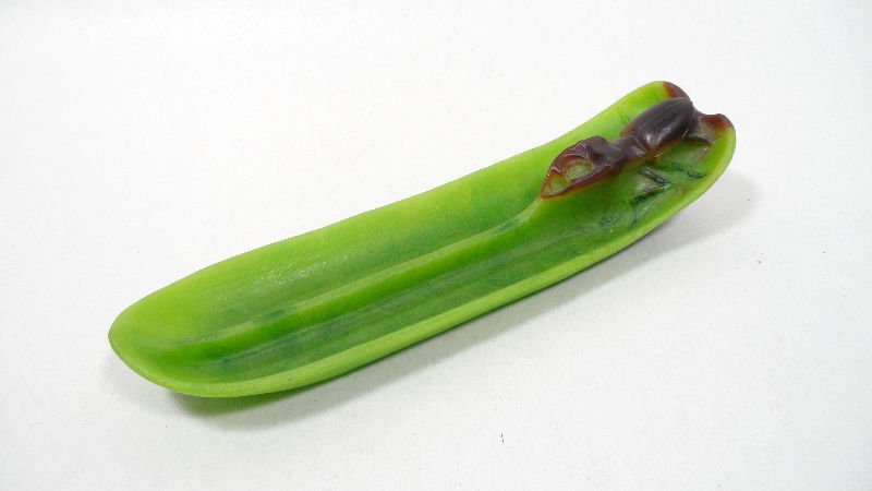 Daum Nancy Pate de Verre Tray: Daum Nancy Pate de Verre Tray by A. Walter in art nouveau style featuring a bwoen locus on a green petal. Circa 1920. measures 9 1/2" long x 1 3/4" height x 2 1/2" depth. For international shipping an