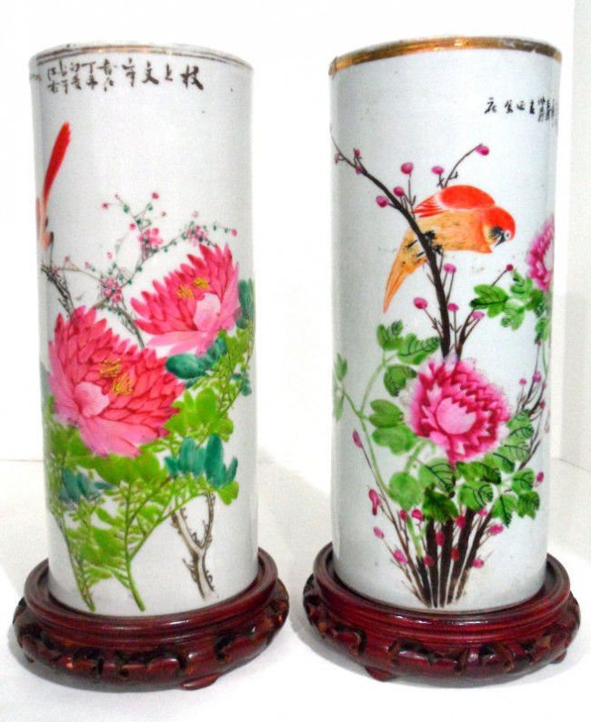 Pair of Chinese Porcelain Hat Stands w/Wooden Base: Pair of antique Chinese hat stand vases with wooden bases. They are cylindrical in shape and feature birds and flowers. There are Chinese character marks along the top rim of the bottom. Fitted wooden
