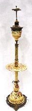 Rare Art Nouveau Zsolnay Table Lamp: Rare art nouveau zsolnay table lamp with rose colored flowers on a cream backround . This is a wonderful lamp with ornate brass fittings. Mesures 5'4" tall. For Domestic and international shipping quo