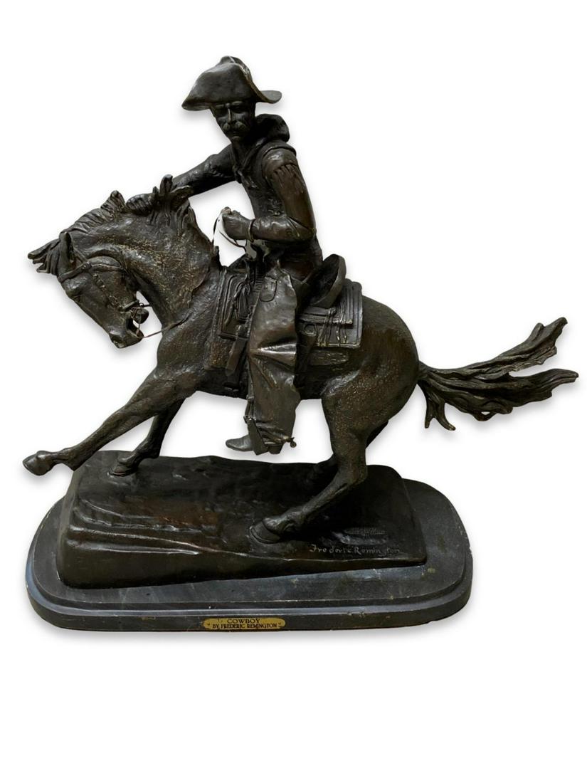Signed After Frederic Remington (1861-1909) Bronze Sculpture Cowboy on Black Marble Base: Signed After Frederic Remington (1861-1909) Bronze Sculpture Cowboy on Black Marble Base measures H: 21"
