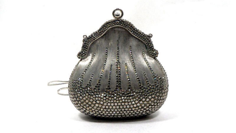 Judith Leiber Silver Evening Purse: Judith Leiber silver purse with mirror inside. Decorated with crystal stones throughout. Measures 5" H x 5" x 2 1/2" in depth. For shipping and insurance quotes please call Ryan or Dave at Eagle Shipp